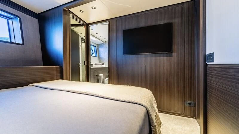 a bed in a room aboard AT ONE Yacht for Charter