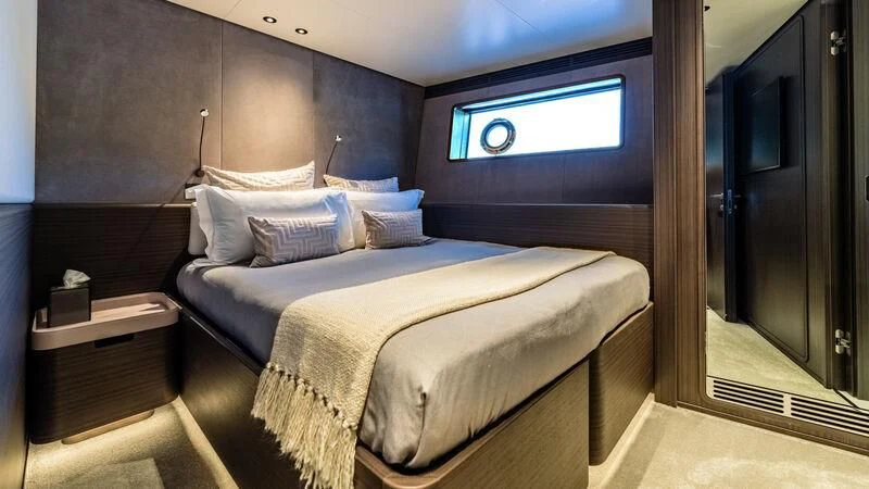 a bed in a room aboard AT ONE Yacht for Charter