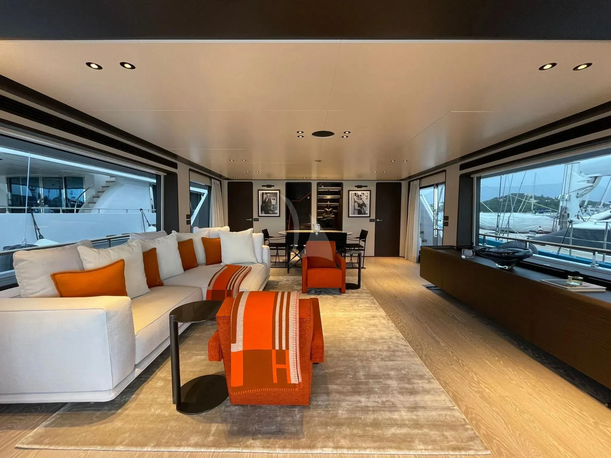 a living room with a large window aboard AT ONE Yacht for Charter