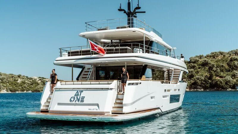 a couple of people on a boat aboard AT ONE Yacht for Charter