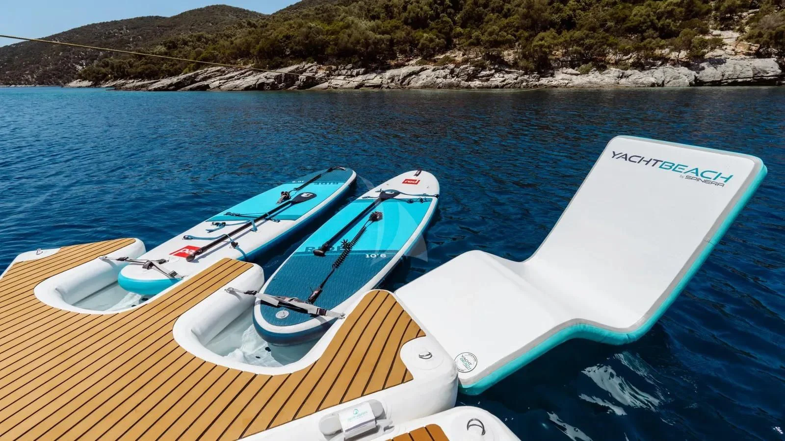 a couple of boats on a body of water aboard AT ONE Yacht for Charter