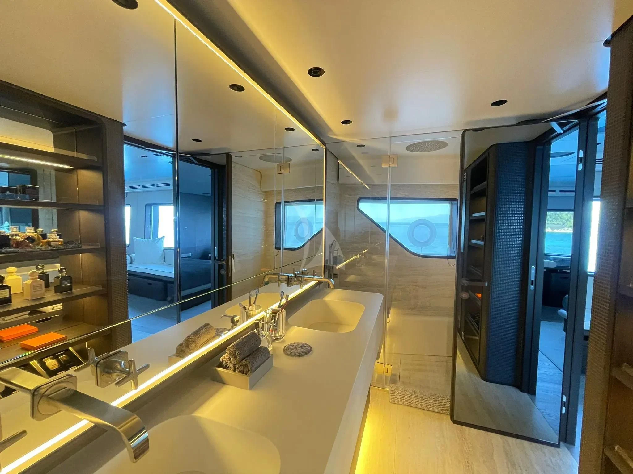 a bathroom with a large glass shower aboard AT ONE Yacht for Charter