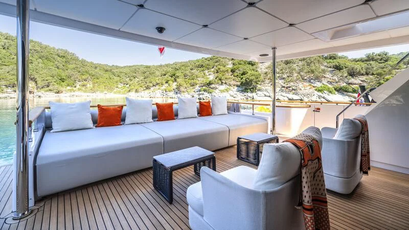 a large bed with pillows on it aboard AT ONE Yacht for Charter
