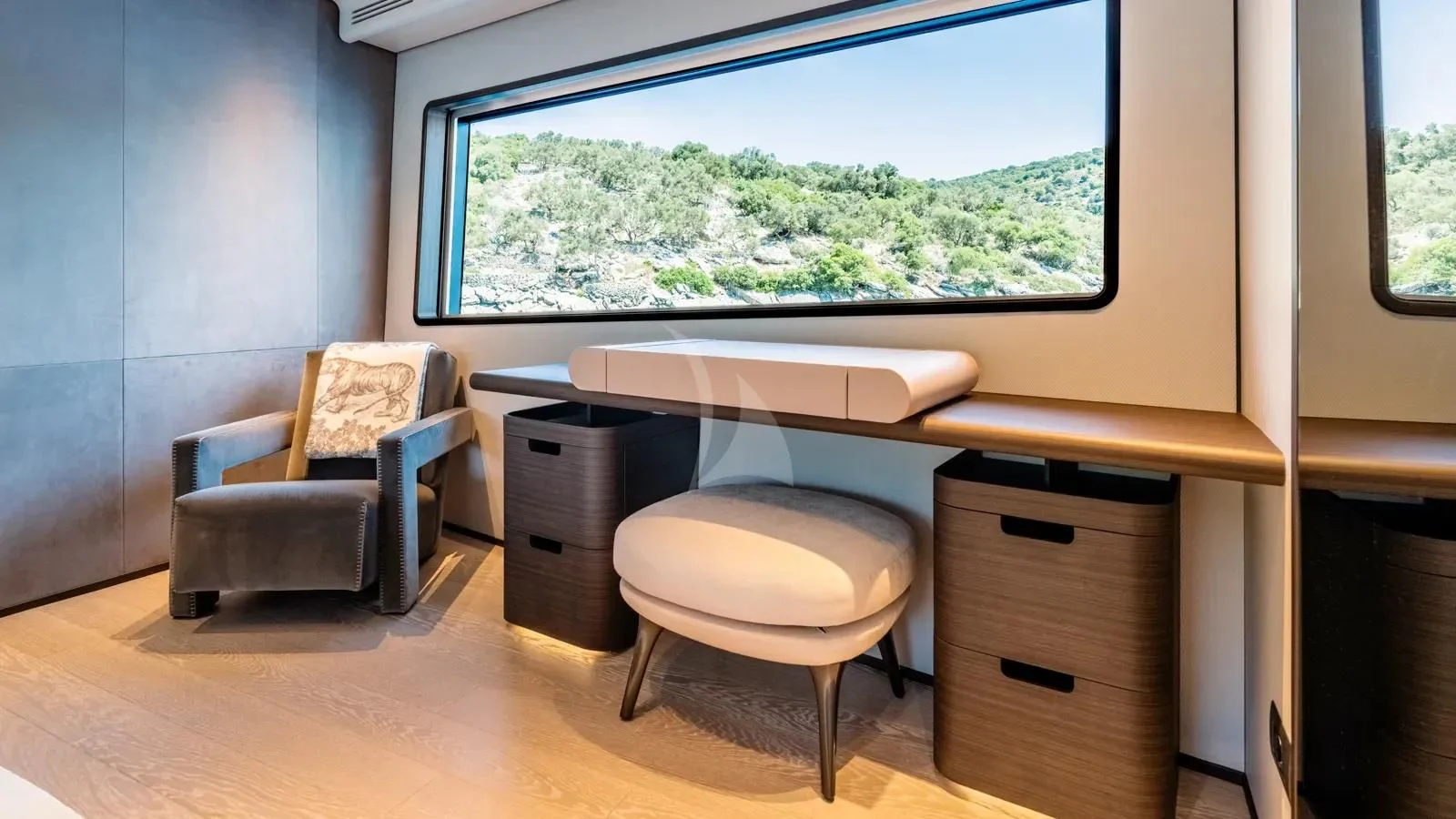 a room with a desk and a window aboard AT ONE Yacht for Charter