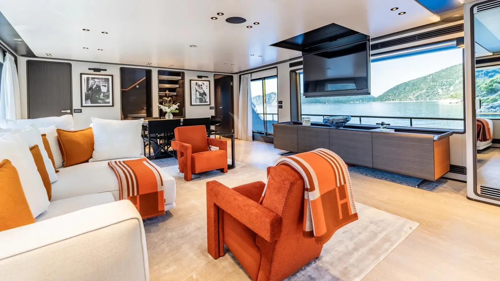 a living room with a large window aboard AT ONE Yacht for Charter