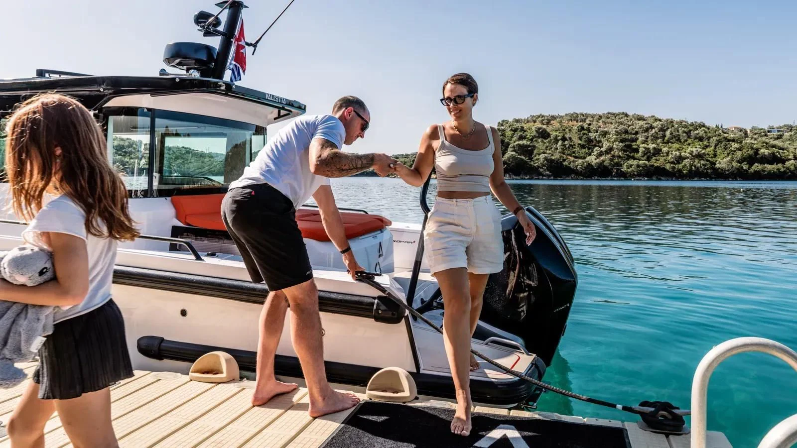a group of people on a boat aboard AT ONE Yacht for Charter
