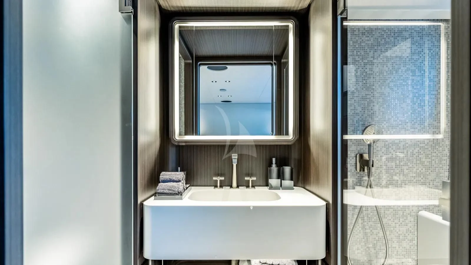 a bathroom with a sink and a mirror aboard AT ONE Yacht for Charter