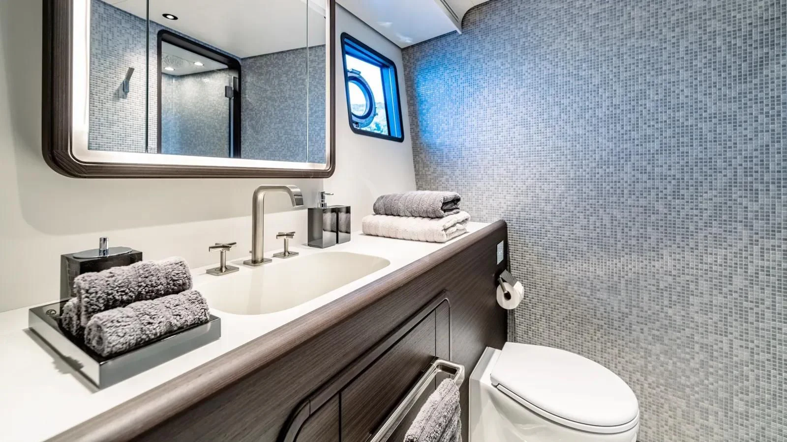 a bathroom with a sink and a toilet aboard AT ONE Yacht for Charter