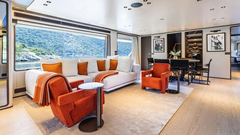 a living room with a large window aboard AT ONE Yacht for Charter