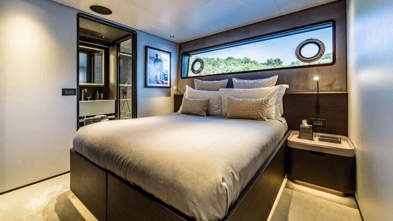 a bed in a room aboard AT ONE Yacht for Charter