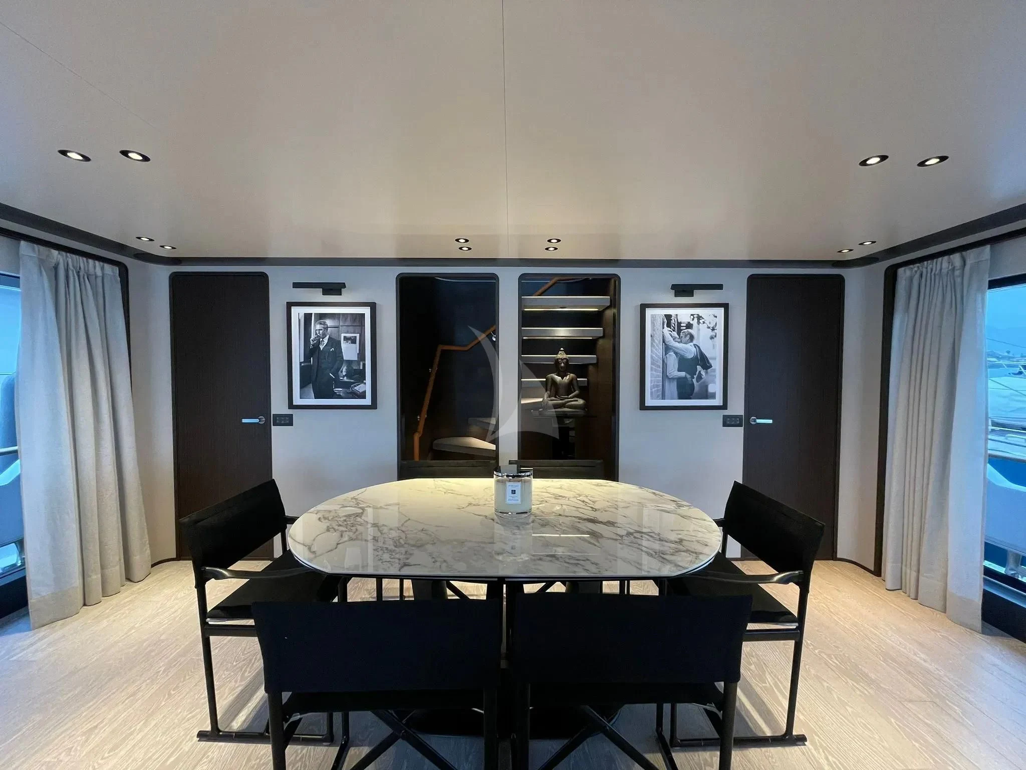 a room with a table and chairs aboard AT ONE Yacht for Charter