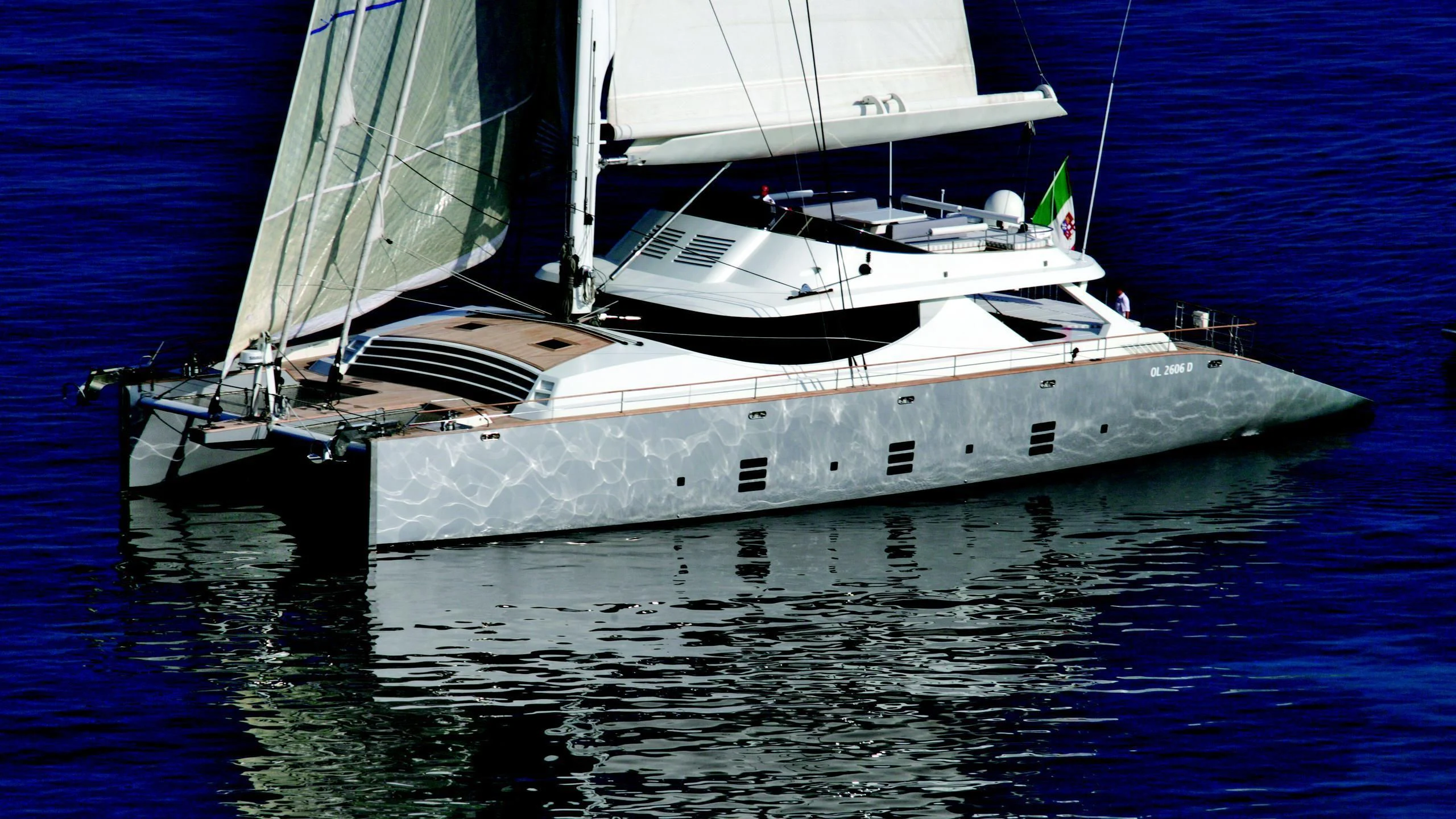 a white boat on the water aboard MANTANI Yacht for Sale