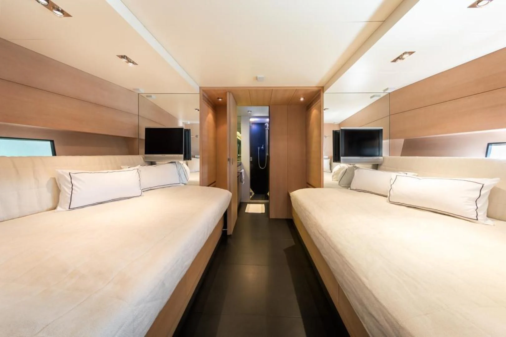 a room with a bed and a tv aboard ASH Yacht for Sale