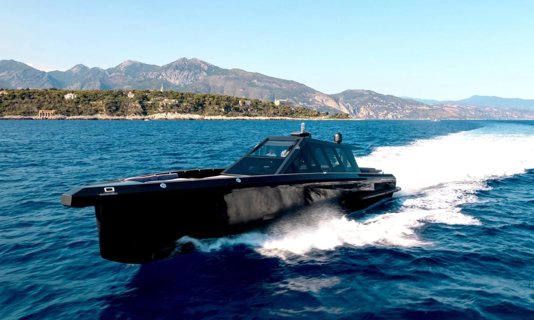 a speed boat on the water aboard ASH Yacht for Sale
