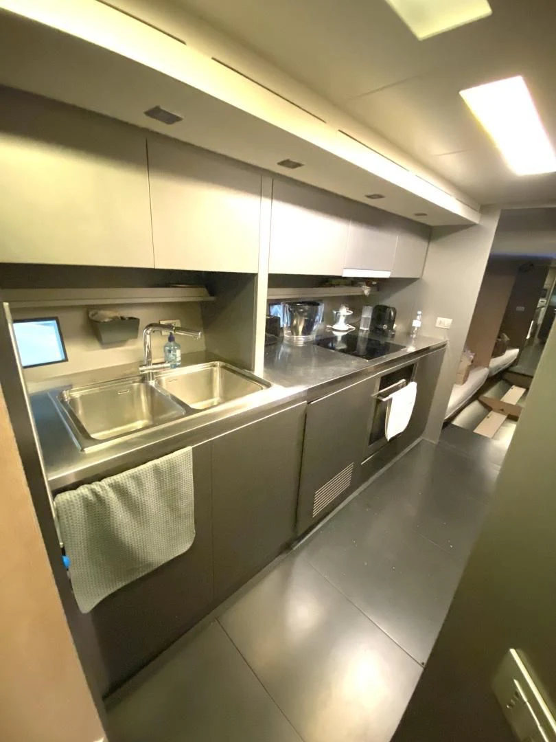 a kitchen with a large island aboard ASH Yacht for Sale
