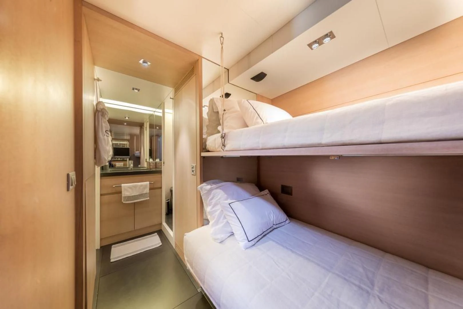 a room with a bed and a closet aboard ASH Yacht for Sale