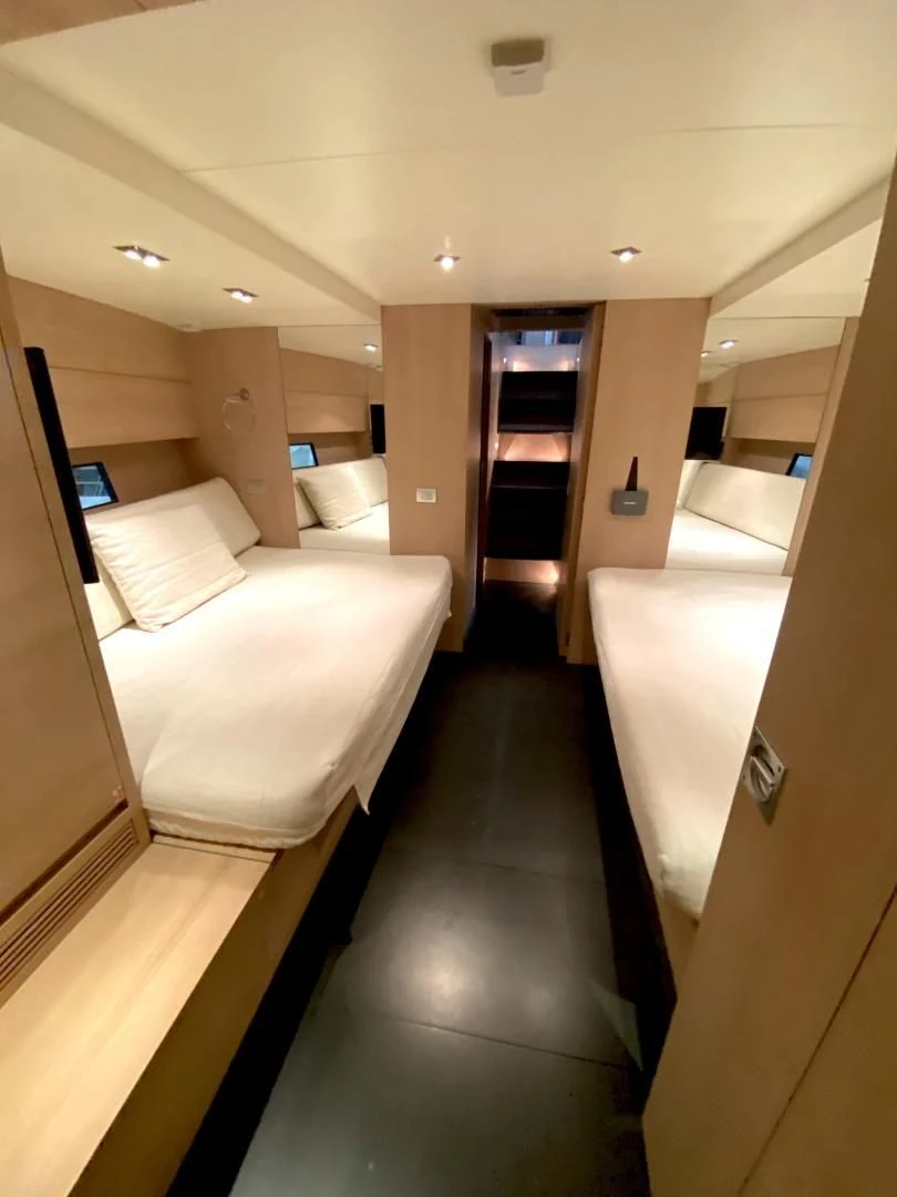a room with a bed and a door aboard ASH Yacht for Sale
