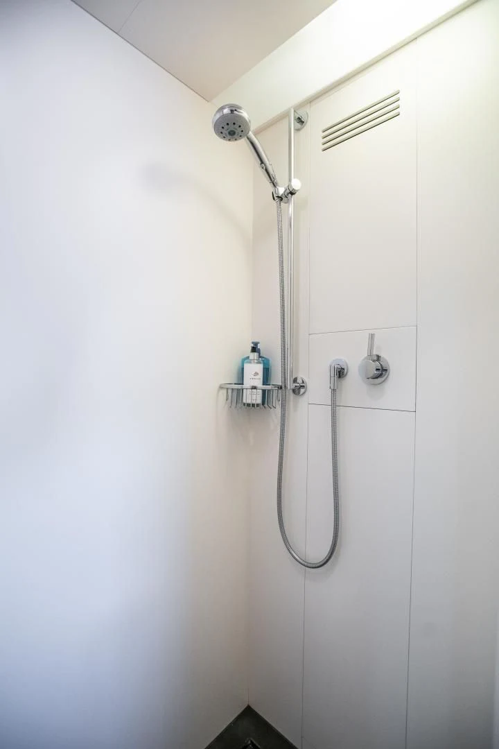 a shower with a clear glass door aboard ASH Yacht for Sale