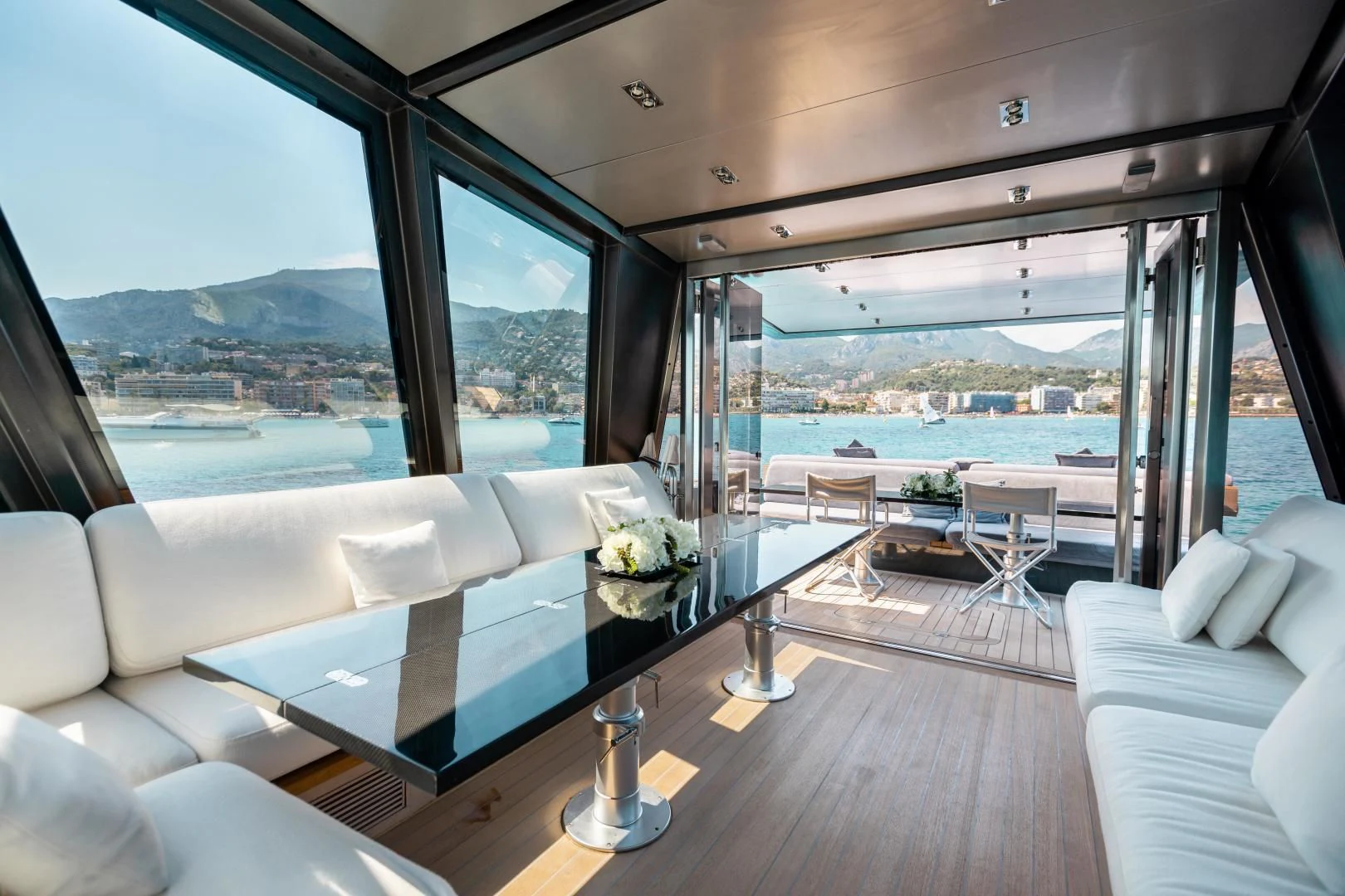 a room with a view of the ocean and the mountains aboard ASH Yacht for Sale