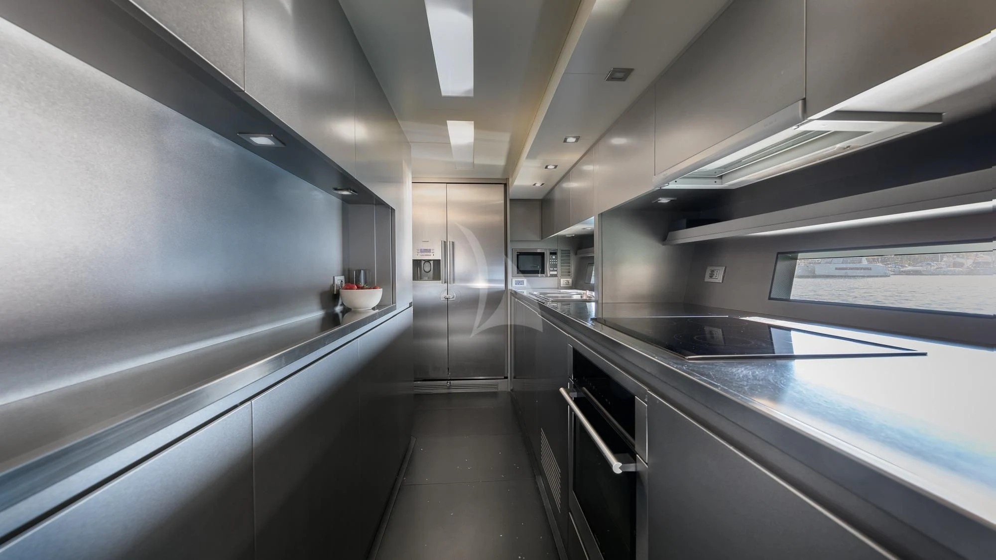 a large kitchen with stainless steel appliances aboard ASH Yacht for Sale