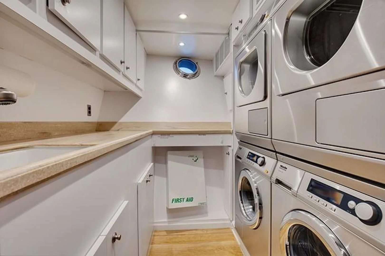 a kitchen with white cabinets aboard MARLINDA Yacht for Sale