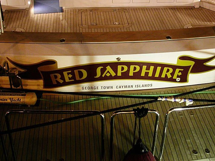 a sign on a metal railing aboard RED SAPPHIRE I Yacht for Sale