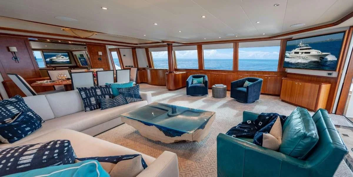 a large living room with a large swimming pool aboard INDIGO Yacht for Sale