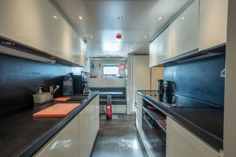 a kitchen with a large island aboard INDIGO Yacht for Sale