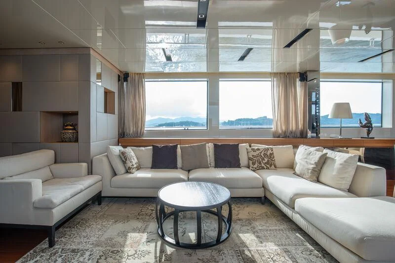 a living room with a couch and a table aboard INDIGO Yacht for Sale