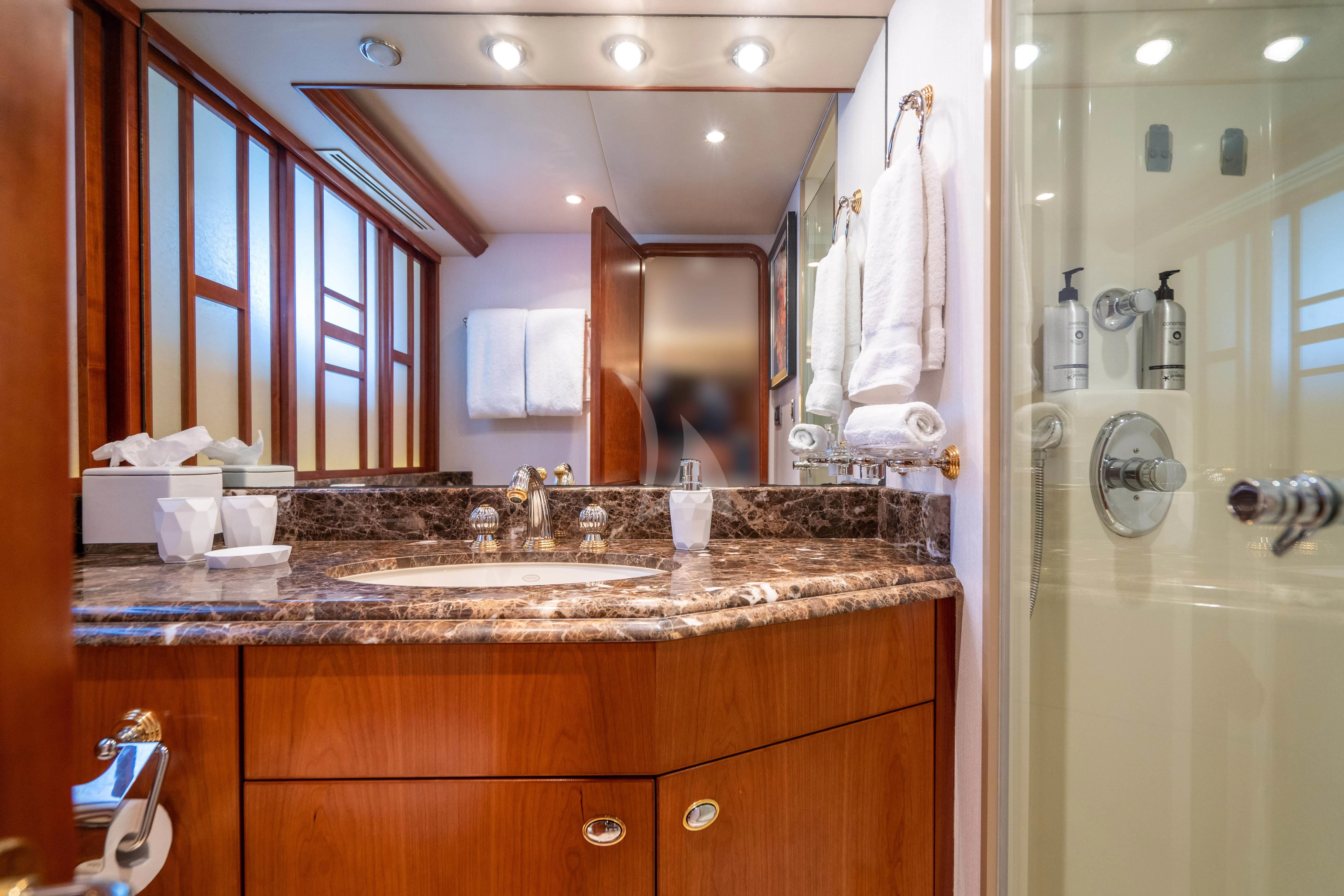 a bathroom with a large mirror aboard INDIGO Yacht for Sale
