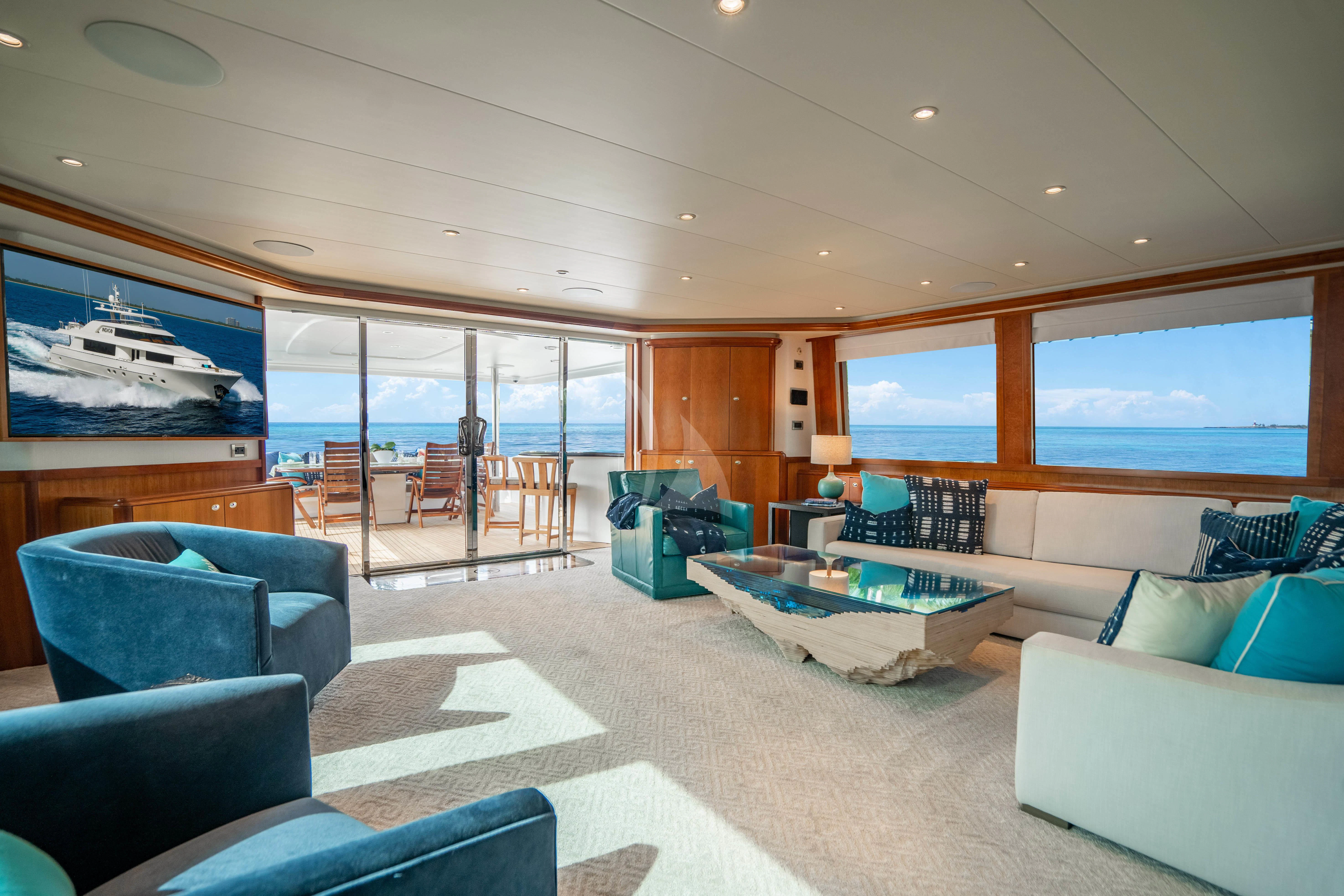 a large living room with a large window aboard INDIGO Yacht for Sale