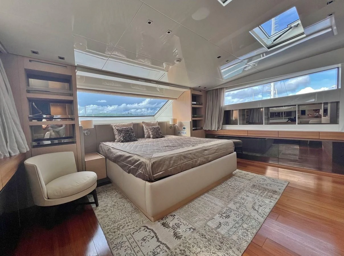 a large living room with a large window aboard INDIGO Yacht for Sale