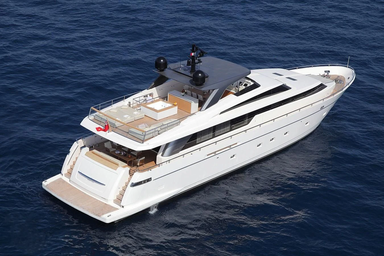 a white boat on the water aboard INDIGO Yacht for Sale