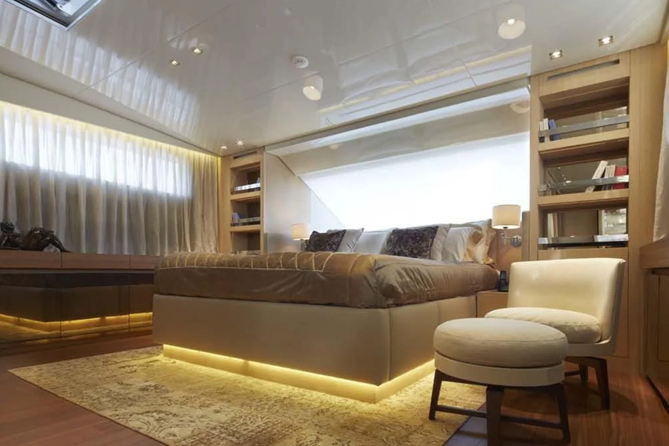 a living room with a couch and a shelf aboard INDIGO Yacht for Sale