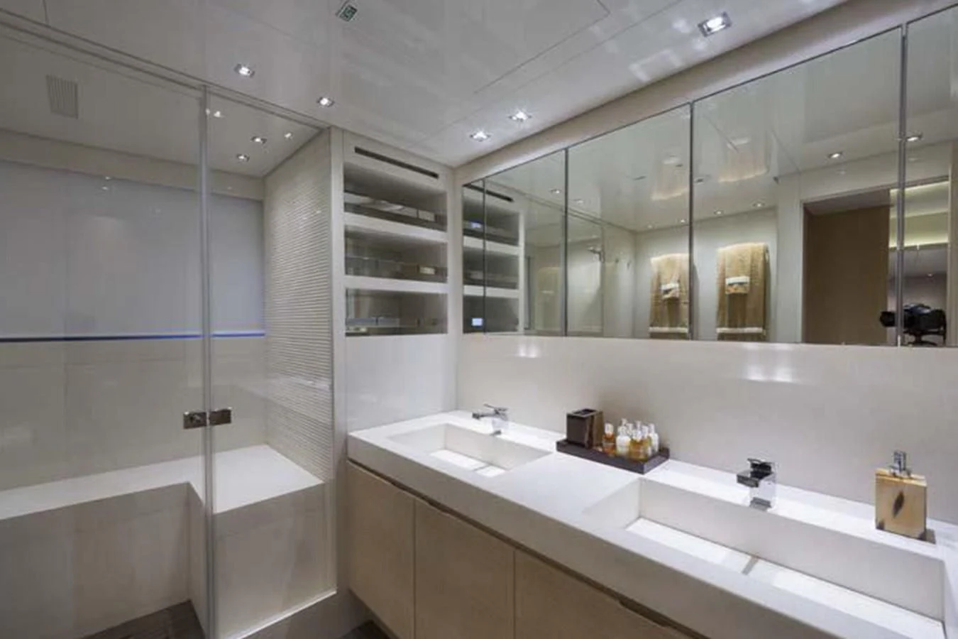 a bathroom with a glass shower aboard INDIGO Yacht for Sale