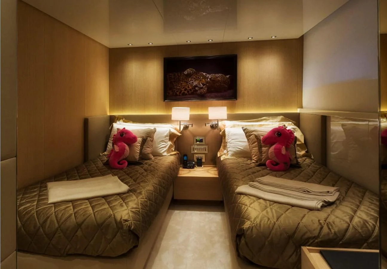 a room with two couches and a stuffed animal aboard INDIGO Yacht for Sale