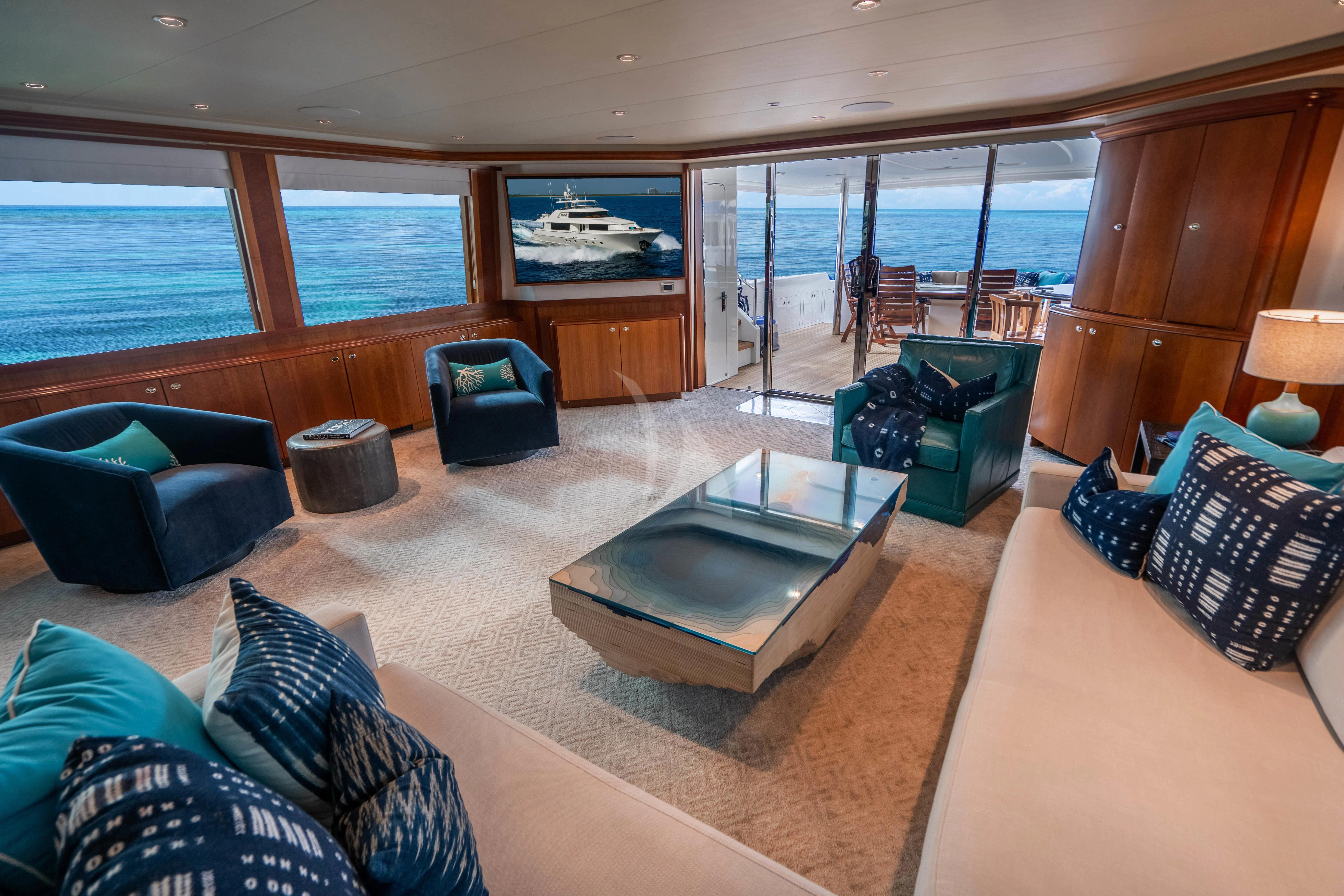 a living room with a large glass window aboard INDIGO Yacht for Sale