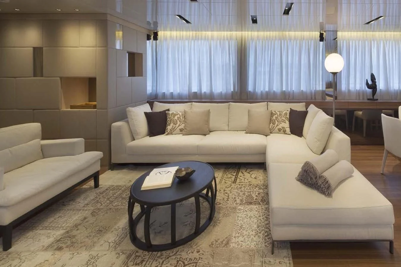 a living room with a couch and a table aboard INDIGO Yacht for Sale