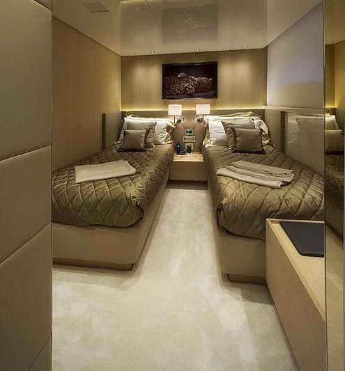 a living room with a couch and a table aboard INDIGO Yacht for Sale