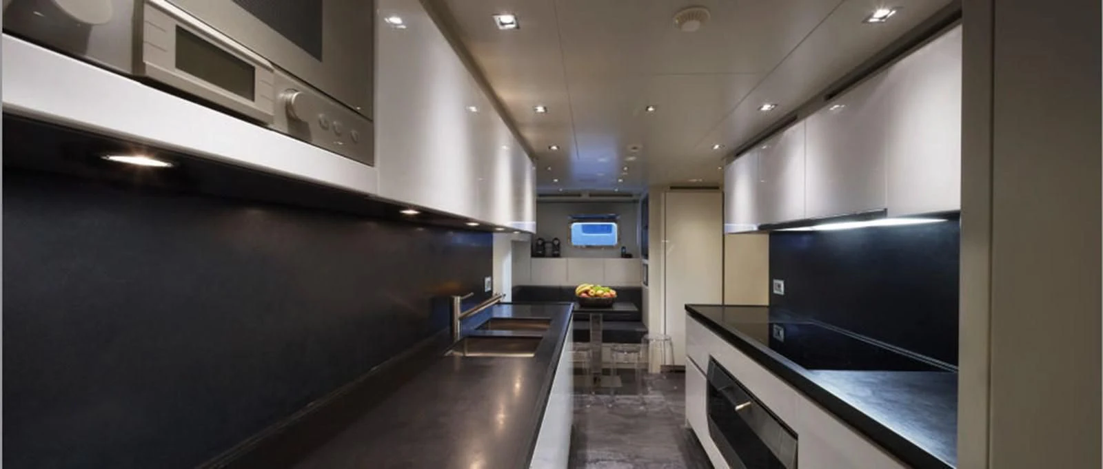 a kitchen with a large island aboard INDIGO Yacht for Sale
