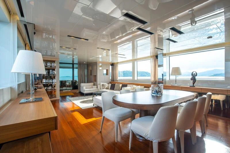 a room with a table and chairs aboard INDIGO Yacht for Sale