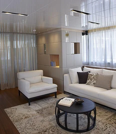 a living room with a couch and a table aboard INDIGO Yacht for Sale