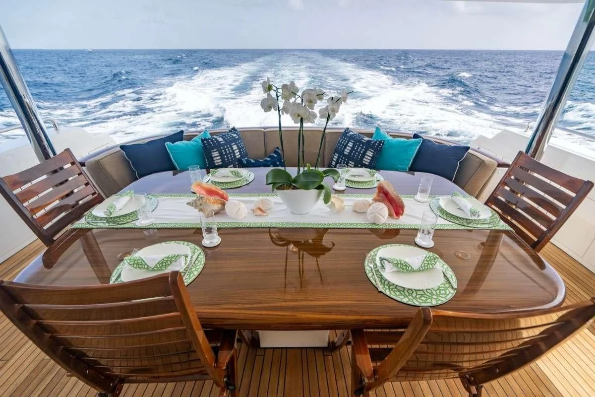 a table with a set of chairs on it aboard INDIGO Yacht for Sale