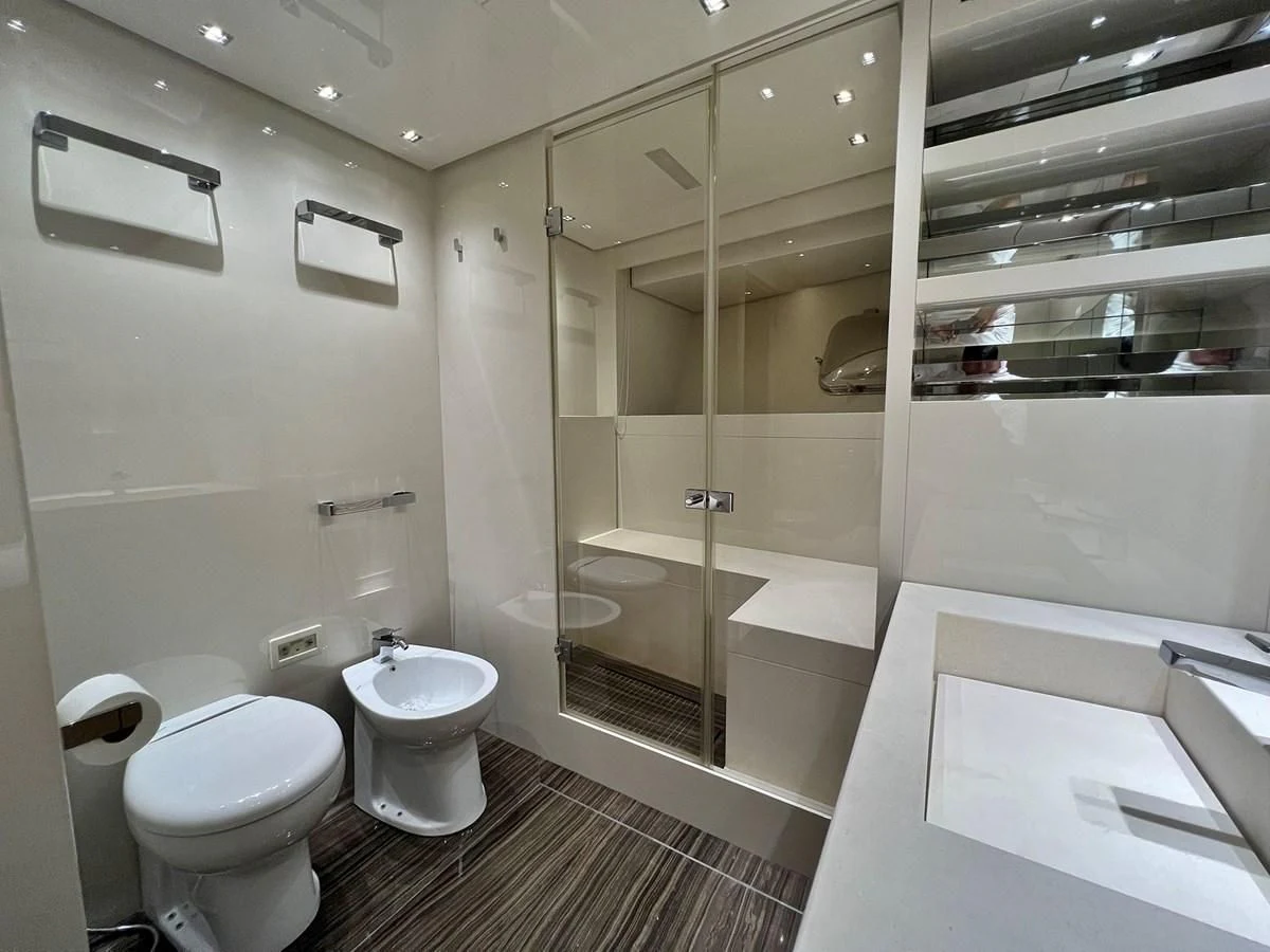 a bathroom with a glass shower aboard INDIGO Yacht for Sale