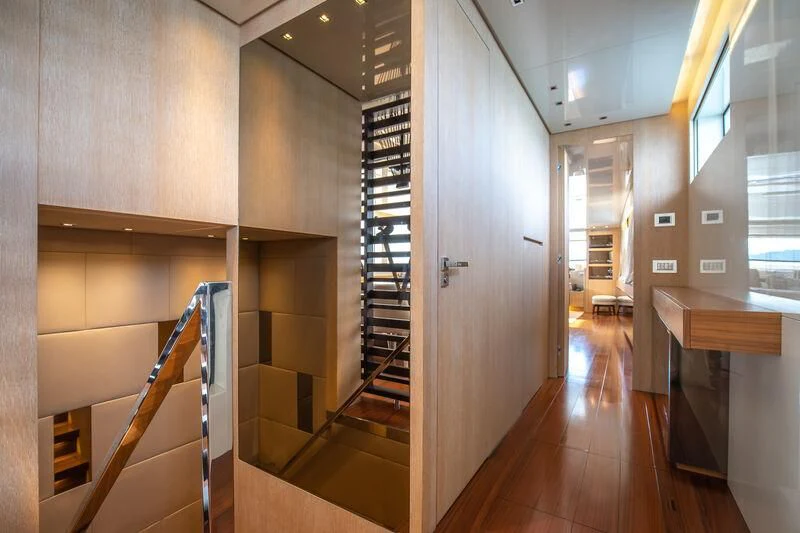 a hallway with a set of stairs aboard INDIGO Yacht for Sale