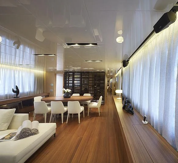 a room with a table and chairs aboard INDIGO Yacht for Sale