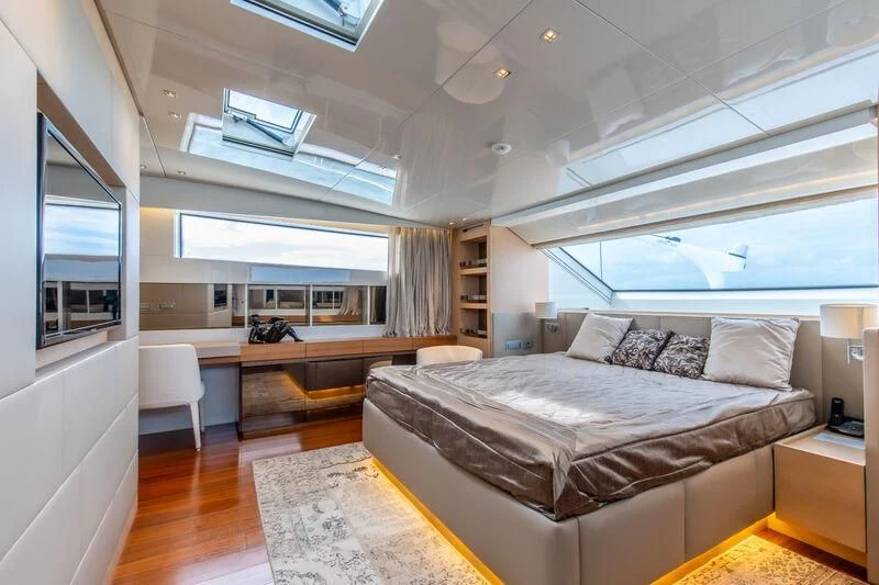 a bedroom with a large bed aboard INDIGO Yacht for Sale