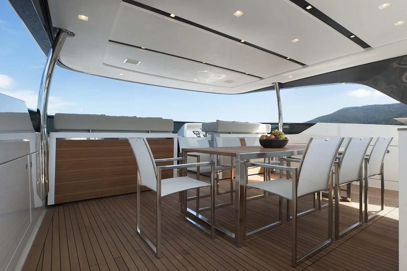 a room with a table and chairs aboard INDIGO Yacht for Sale