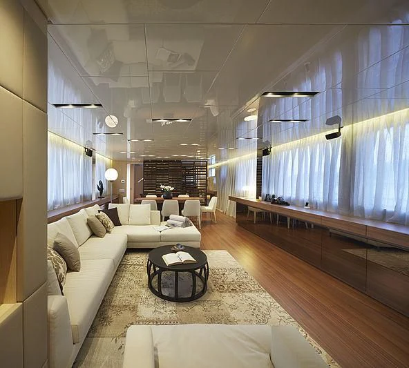 a living room with a large window aboard INDIGO Yacht for Sale