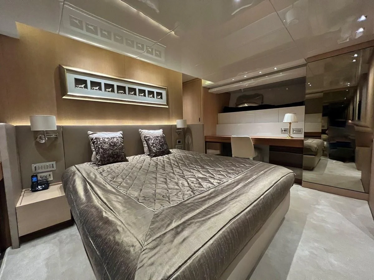 a bed in a hotel room aboard INDIGO Yacht for Sale